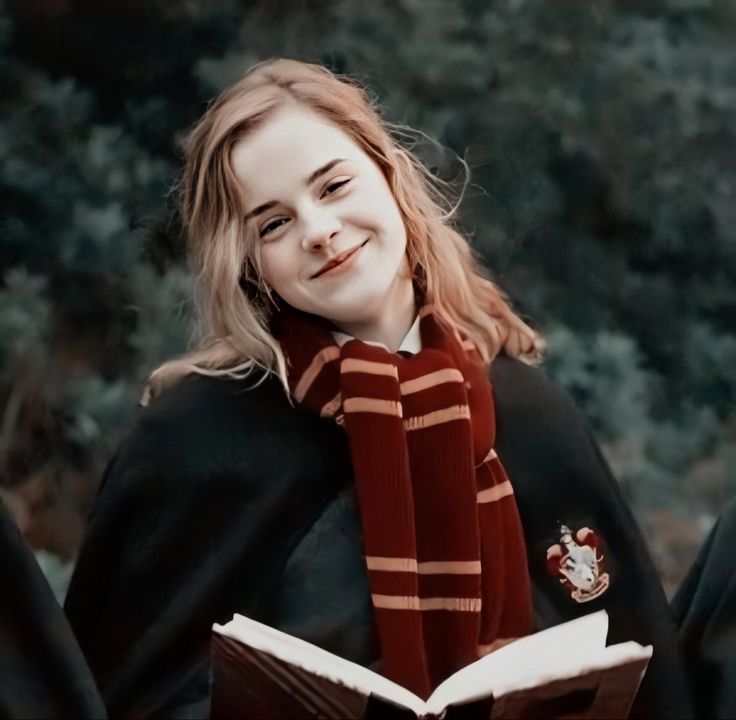 Hermione Granger smiling-winters-wearing gryffindor scarf